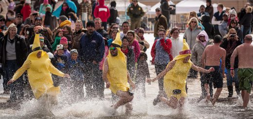 Big Bear Polar Plunge three men dressed in banana costumes in water